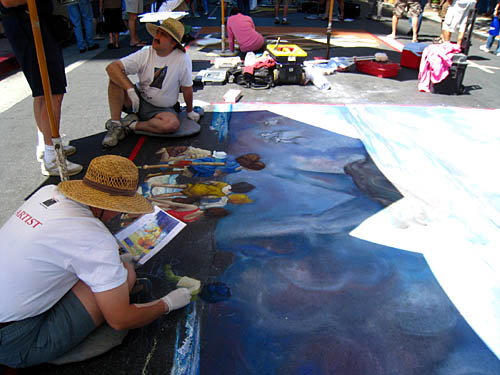 Cheryl and Wayne work at base of painting