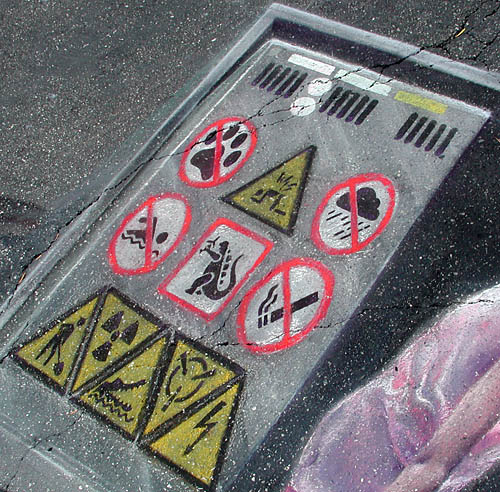 Warning labels on the power supply (includes warnings about Godzilla and crocodiles)
