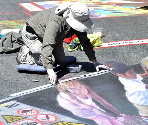 Wayne aligns a straightedge along the rim of the box